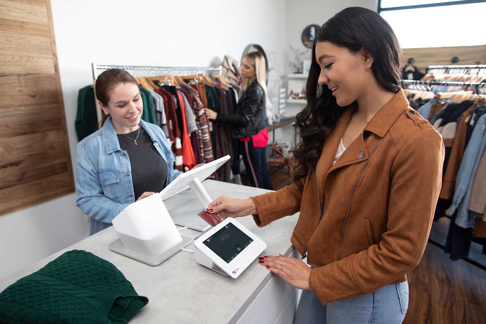 Retail Business- A girl makes digital payment at retail counter after purchase